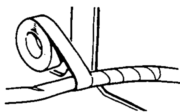 Roll of tape being wrapped around a harness where it crosses a sharp edge, depicting protecting wires with tape or a tube at sharp edges.