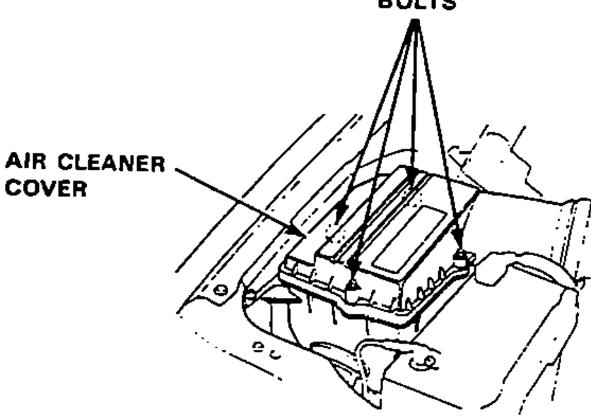 Air cleaner assembly in the engine bay showing the air cleaner cover and the retaining bolts.