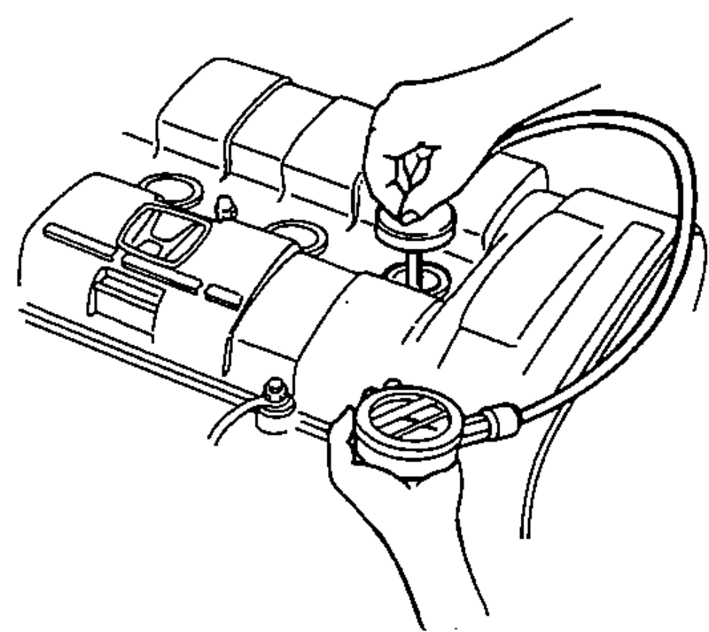 A compression gauge with its adapter fitted into a spark plug hole on the cylinder head to measure compression pressure.