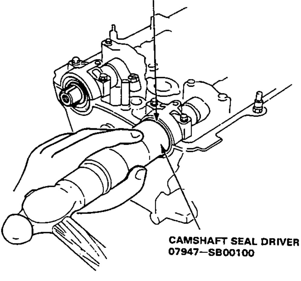 Pressing the camshaft oil seal into the head using the special camshaft seal driver tool.