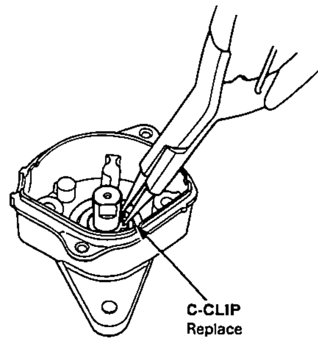 Removing the C-clip from inside the sensor with pliers.