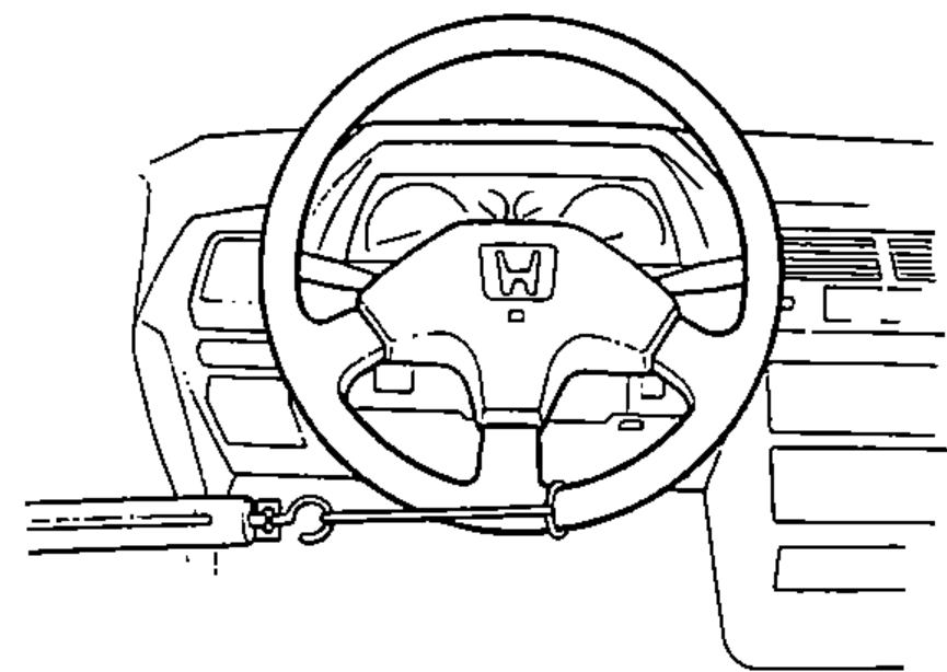 Spring scale attached to the steering wheel rim to measure power assist (steering effort) with the car parked.