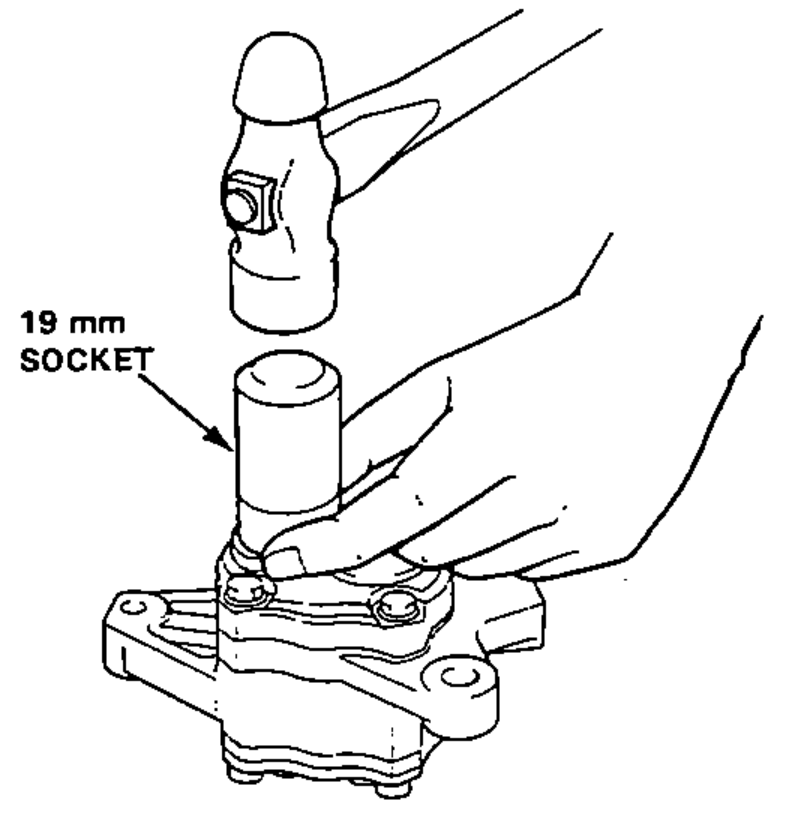 Using a 19 mm socket and hammer to drive the new oil seal the rest of the way into the pump front cover.