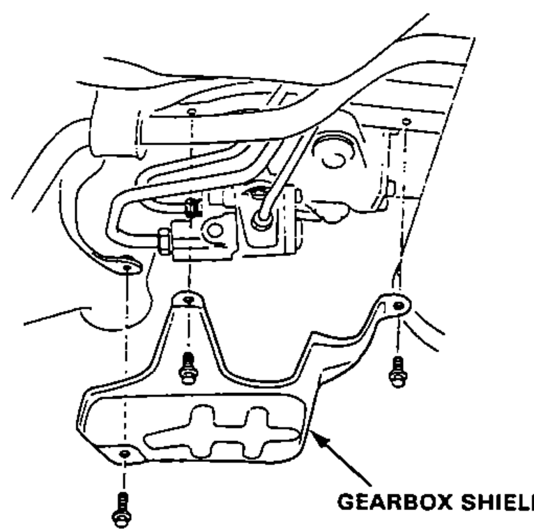 Underside view of the gearbox showing the gearbox shield and its mounting bolts being removed.