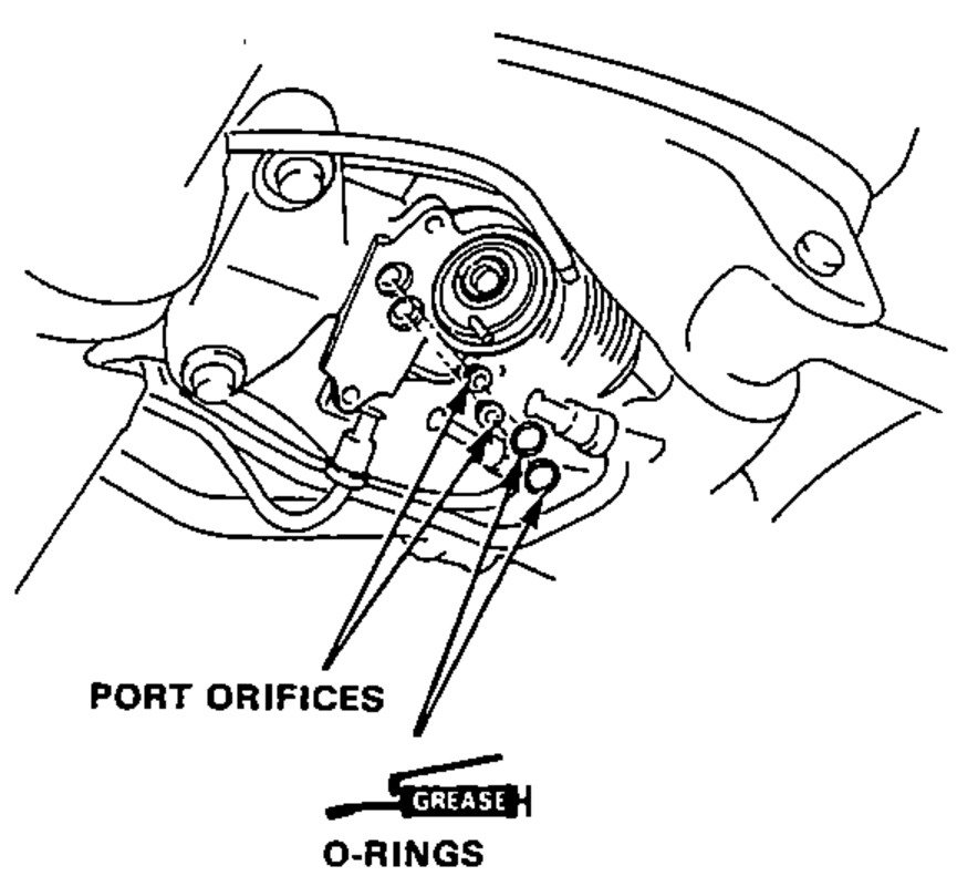 View of the gear housing showing the port orifices and the greased O-rings being installed together with the orifices.