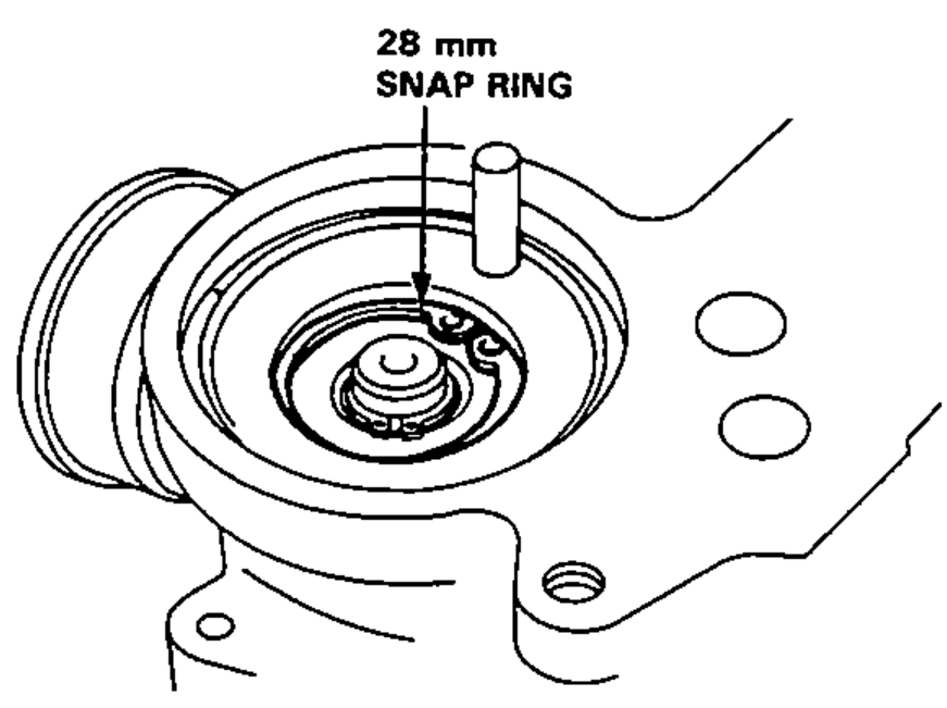 Bottom of the gear housing showing the 28 mm snap ring being removed.