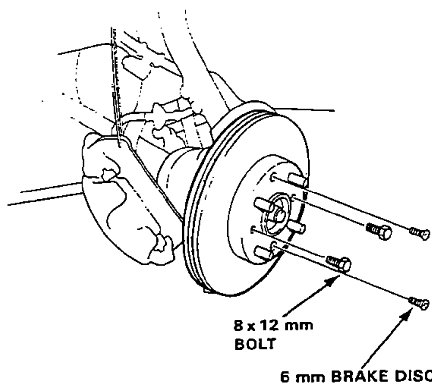 Brake disc being pushed off the hub using two bolts threaded into the disc; shows the disc retaining screw and the 8 x 12 mm push bolts.