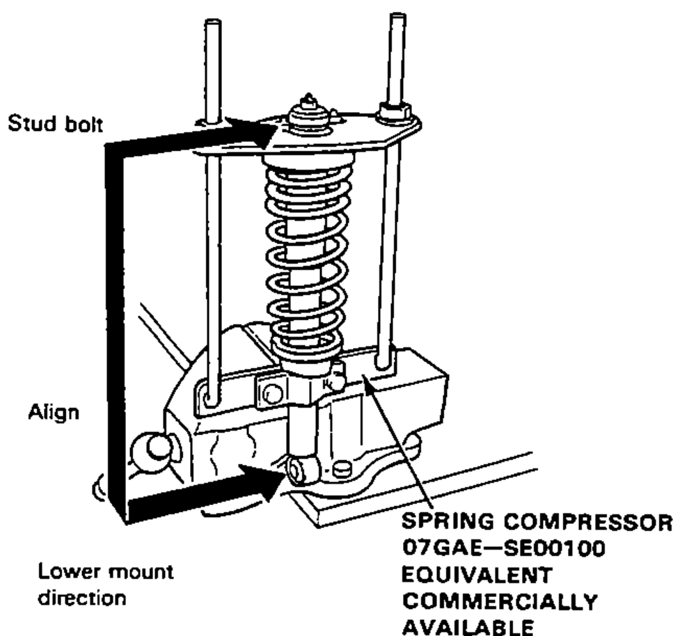 Rear damper unit and coil spring on the spring compressor, showing the stud bolt, the align mark and the lower mount direction when installing the damper mounting base.