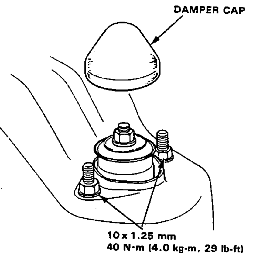 Rear damper upper mount installed on the body with the damper cap above and the upper base mounting nuts torque callout.