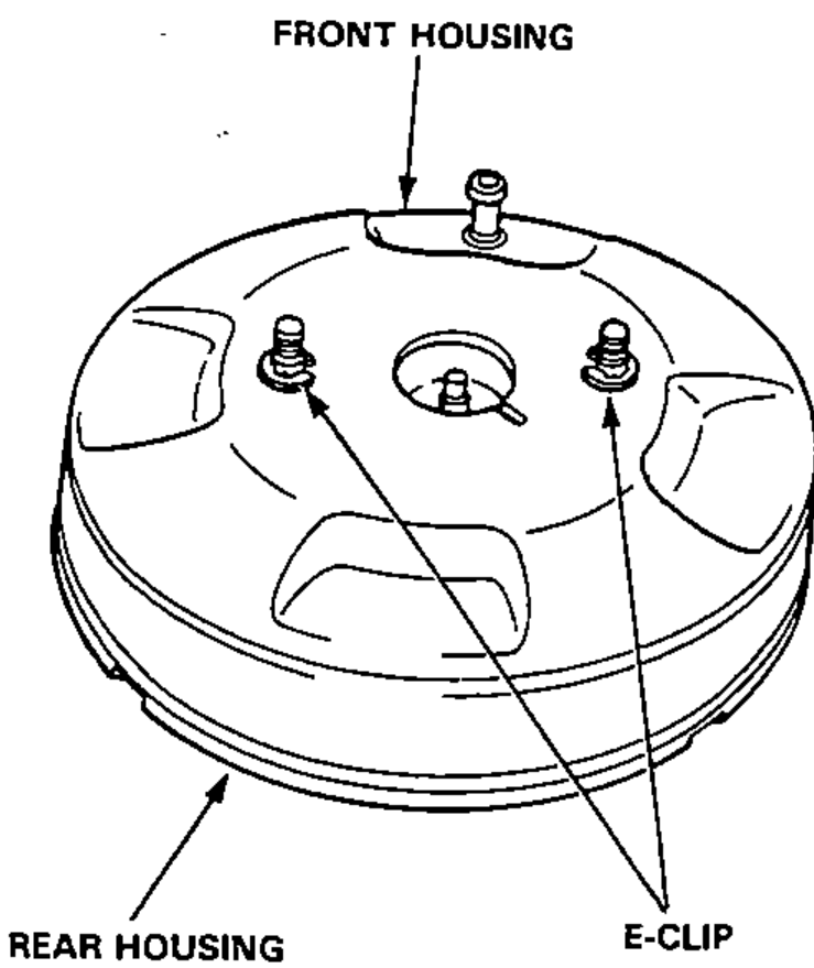 Exploded/assembled view of the brake booster showing the front housing separating from the rear housing, with the E-clips that hold them together.