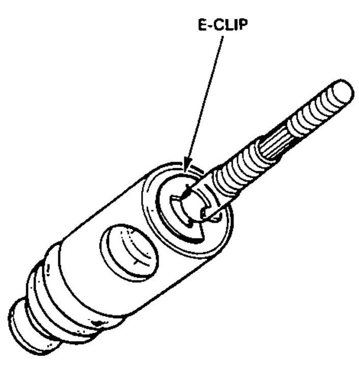 Booster piston / valve body with the E-clip being removed from the push rod.