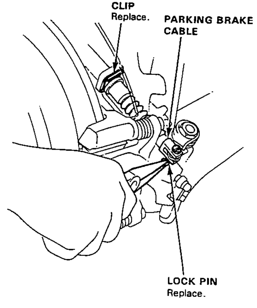 Disconnecting the parking brake cable from the lever on the caliper by removing the lock pin; clip and lock pin marked to be replaced.