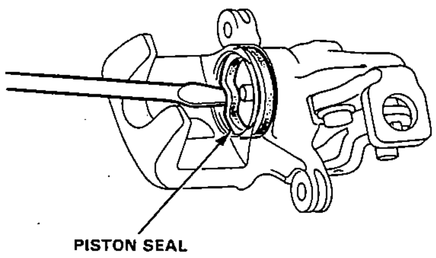 Removing the piston seal from the caliper cylinder bore with a tool.