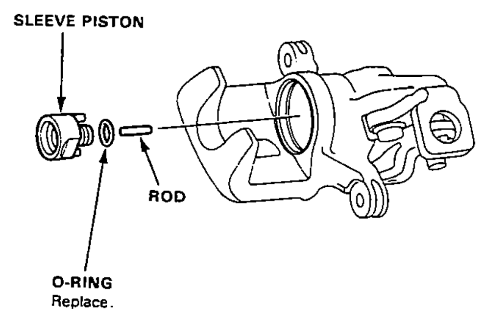 Sleeve piston, rod and O-ring being removed from the caliper cam. O-ring marked replace.