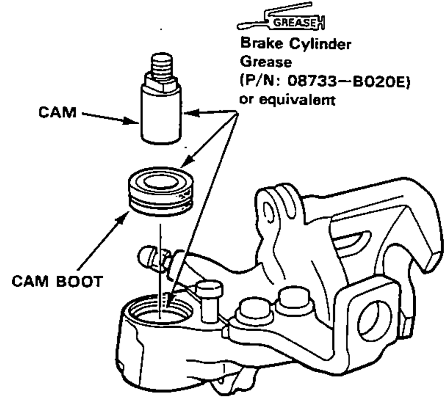 Installing the cam boot and the cam (threaded end facing up) into the caliper, with Brake Cylinder Grease applied.