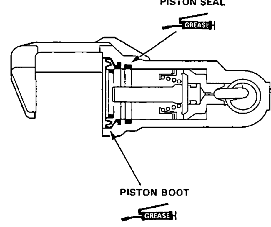 Cutaway view of the caliper showing the new piston seal and piston boot coated with silicone grease and installed in the caliper.