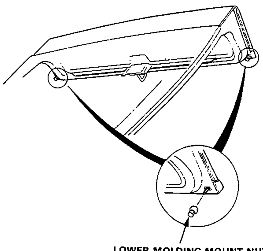 Lower hatch glass corner viewed from below; enlarged circle shows a lower molding mount nut being removed.
