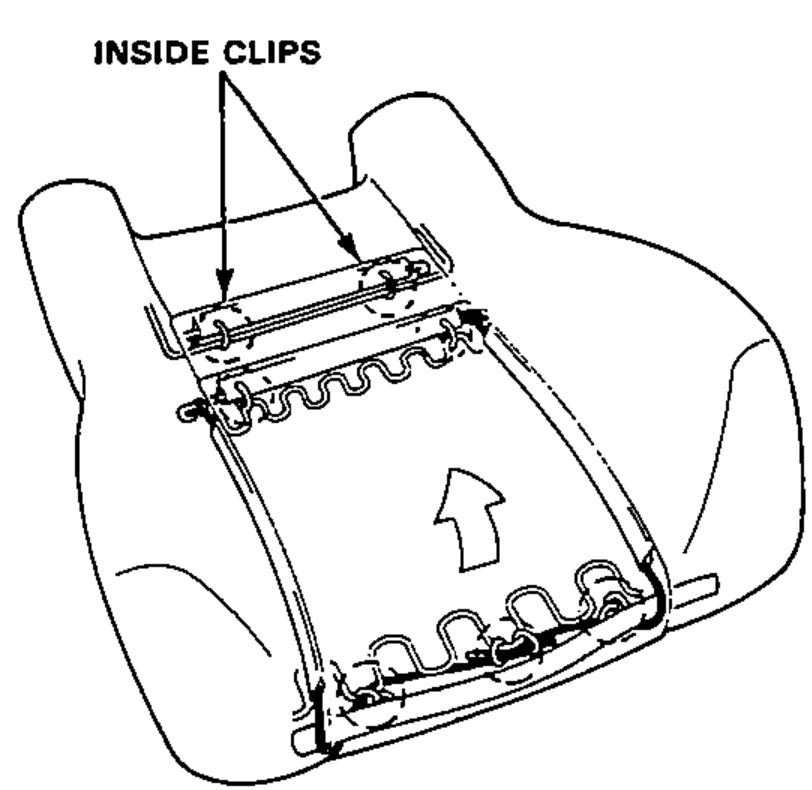 Rear view of the seat back trim cover showing the inside clips at the top edge that must be removed to free the cover.