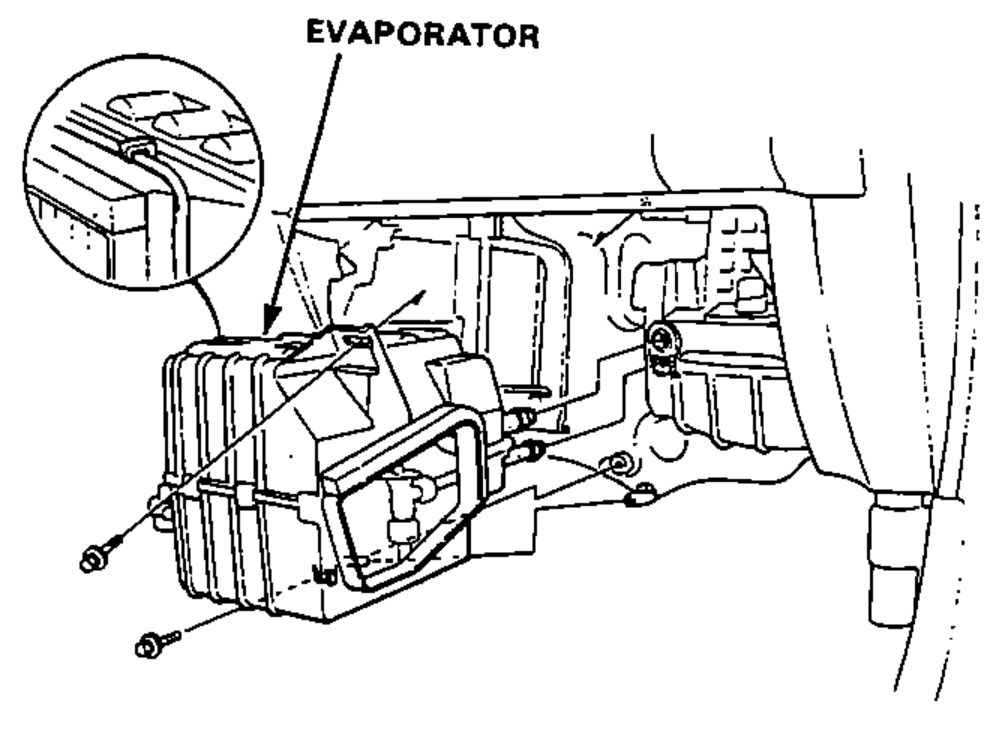 Passenger-side under-dash view showing the A/C evaporator and its mounting/bands.