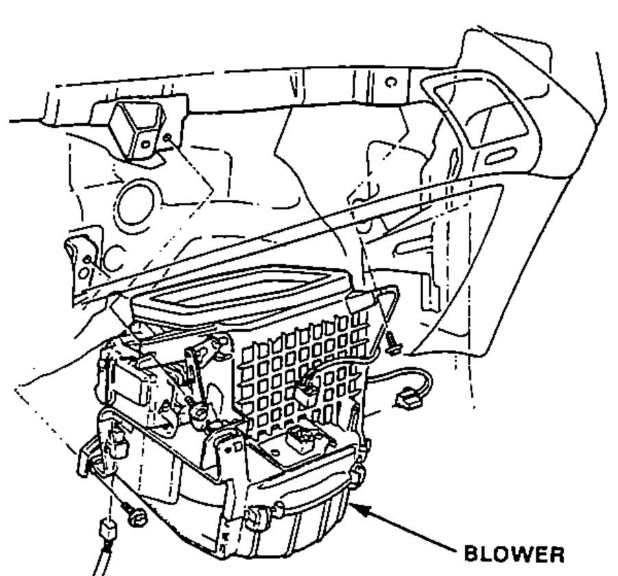 Under-dash view of the blower assembly with its mounting bolts and connectors, being removed.