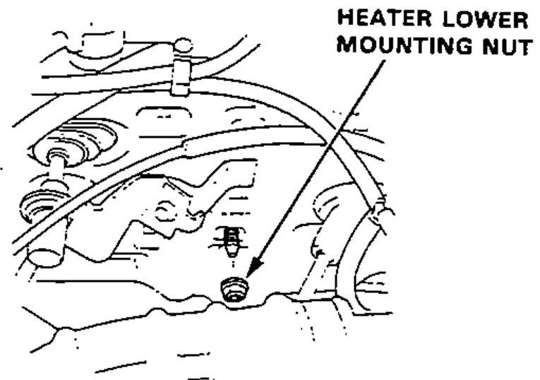 Under-dash view showing the heater lower mounting nut location.