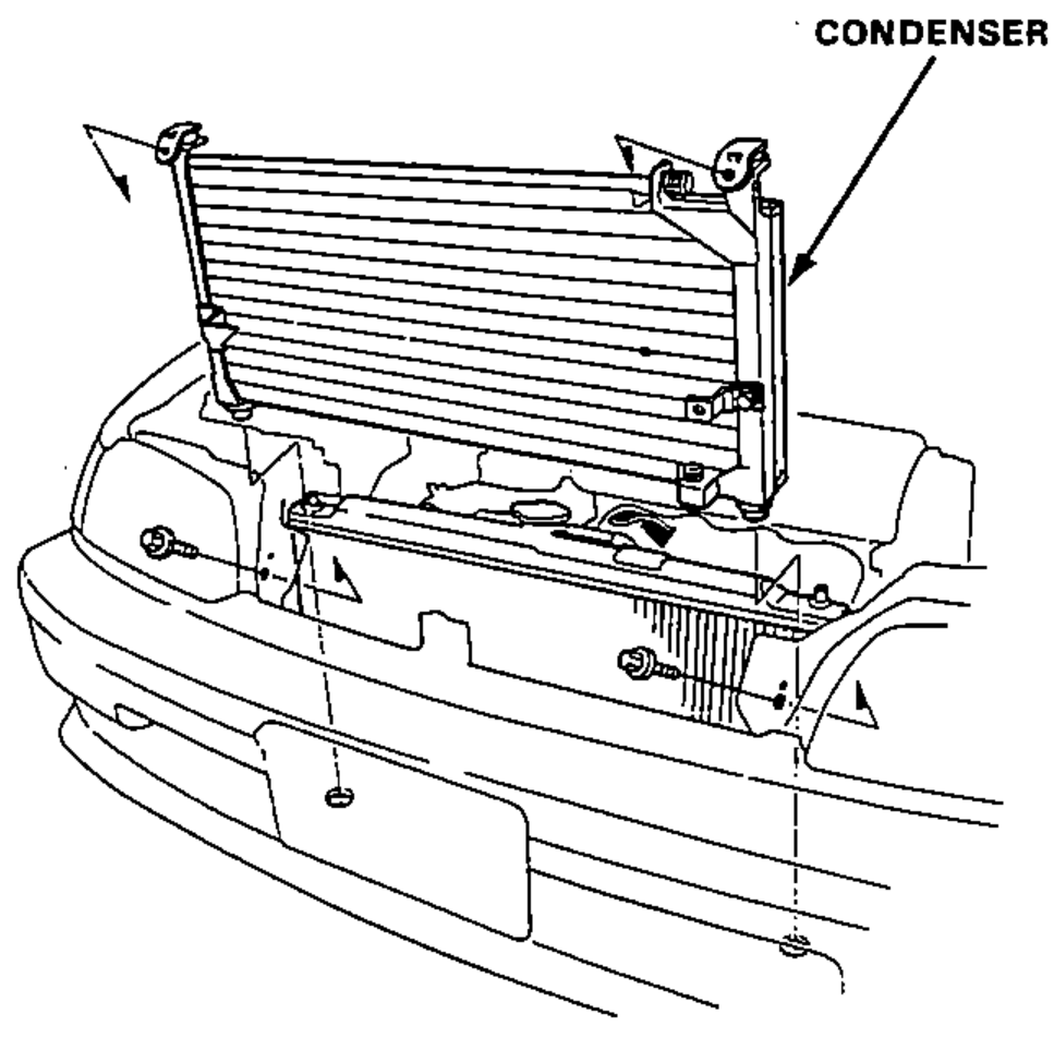 Condenser being removed from the front of the vehicle after the two mounting bolts are taken out.