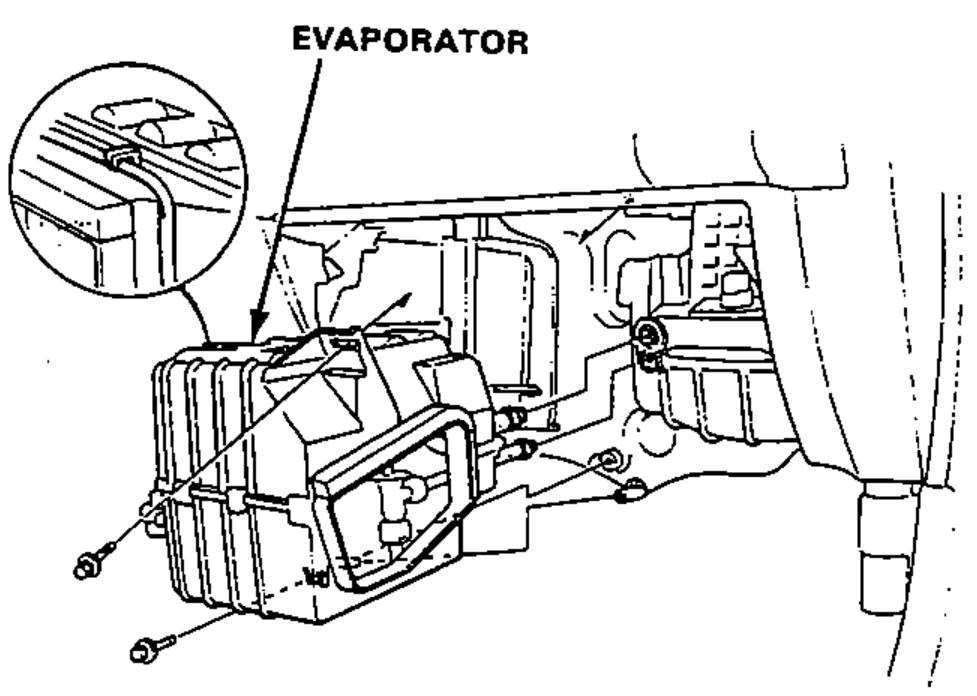 Evaporator unit removal from under the dashboard after the two mounting bolts are removed.