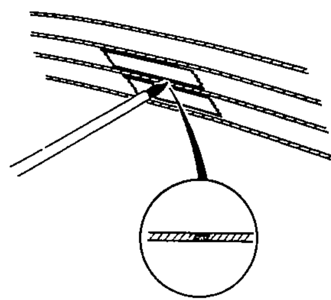 Applying silver conductive paint with a small brush over the break, with a magnified inset of the repaired wire section.