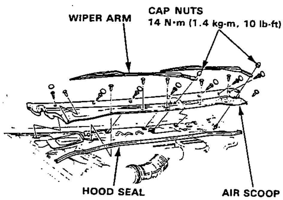 Front cowl area showing the wiper arms, cap nuts, hood seal and air scoop to be removed to access the windshield wiper motor.